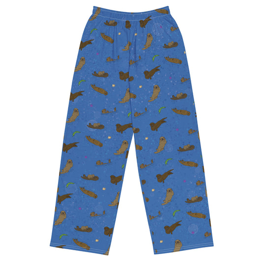Unisex wide leg pants with elastic waistband, white drawstring and side pockets. Features a patterned design of sea otters, shells, seaweed and sea urchins on an ocean blue background.