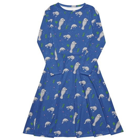 Long sleeve midi dress with boat neckline, fitted waist, side pockets and flared skirt. Features a pattern of illustrated manatees, seaweed, seashells, and bubbles on a dark blue background. Available in sizes from 2XS to 6XL.