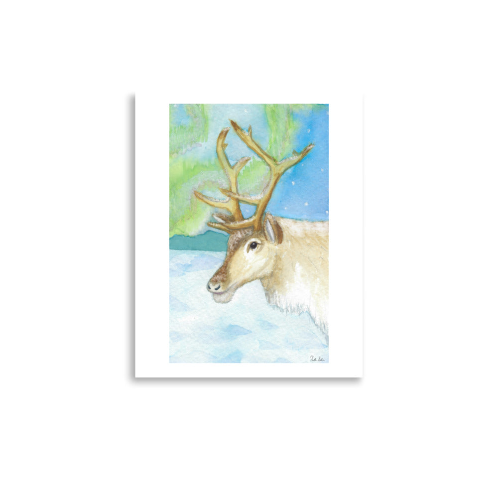 11 by 14 inch art poster print. Watercolor painting of a snowy reindeer with the northern lights in the background.