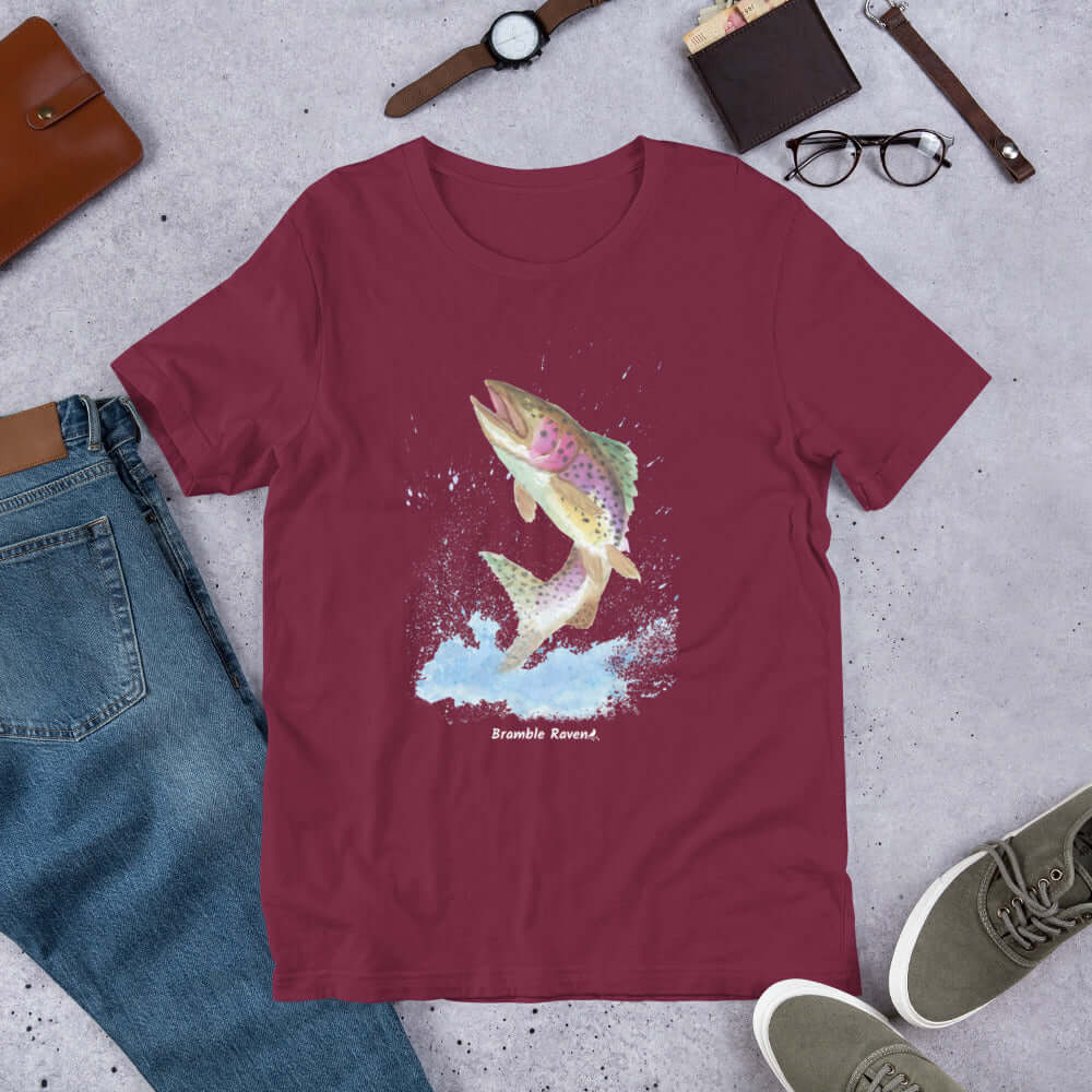Unisex maroon colored t-shirt. Features an original watercolor painting of a rainbow trout leaping from the water.