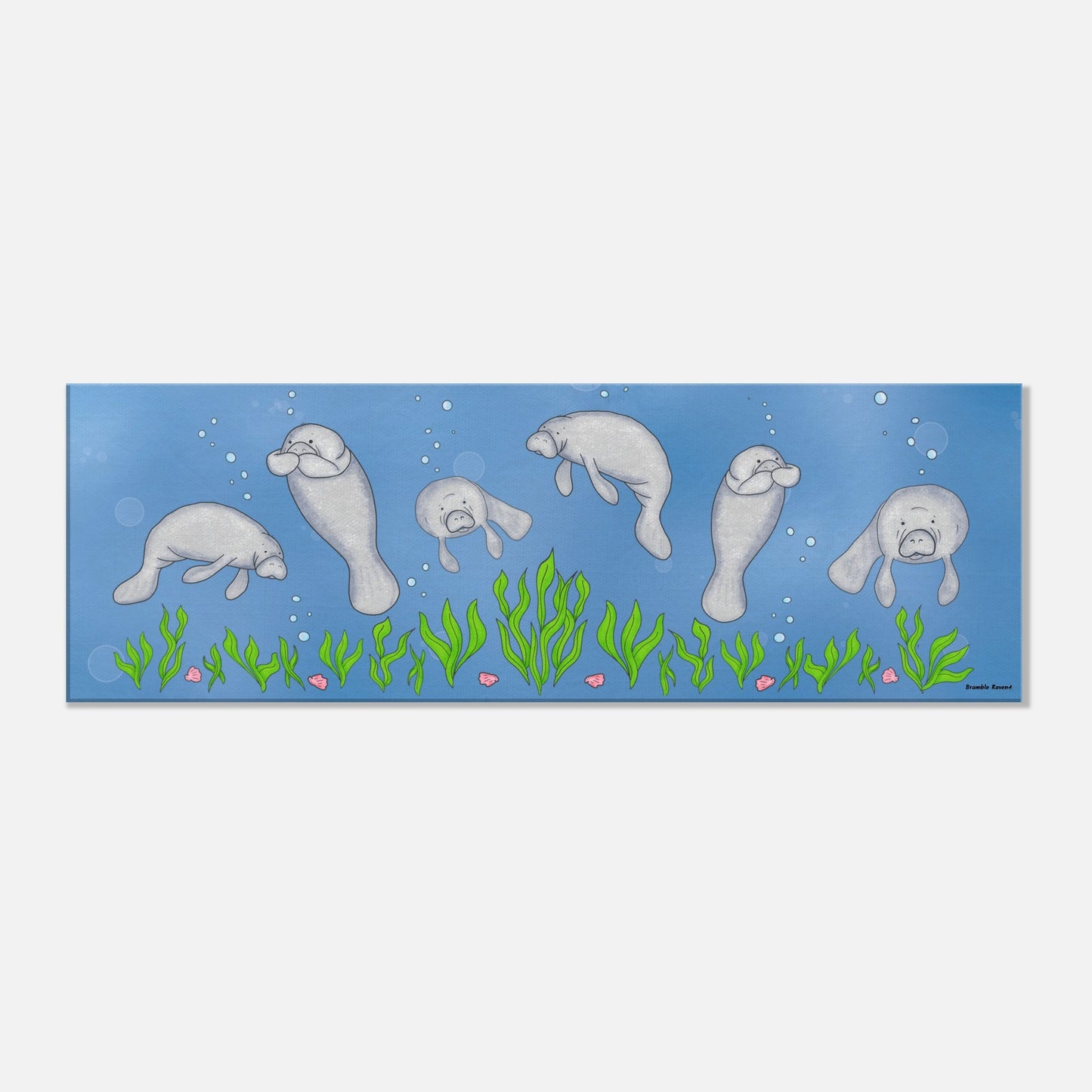 12 by 36 inch slim canvas wall art print featuring cute illustrated manatees swimming above the seabed. Hanging hardware included.