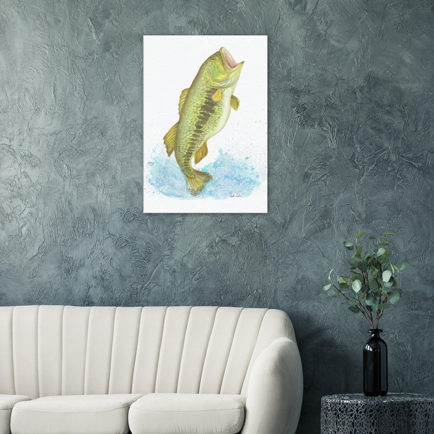 28 by 40 inch slim canvas wall art print featuring a watercolor painting of a largemouth bass leaping from the water. Shown on green wall above white sofa, end table, and vase.