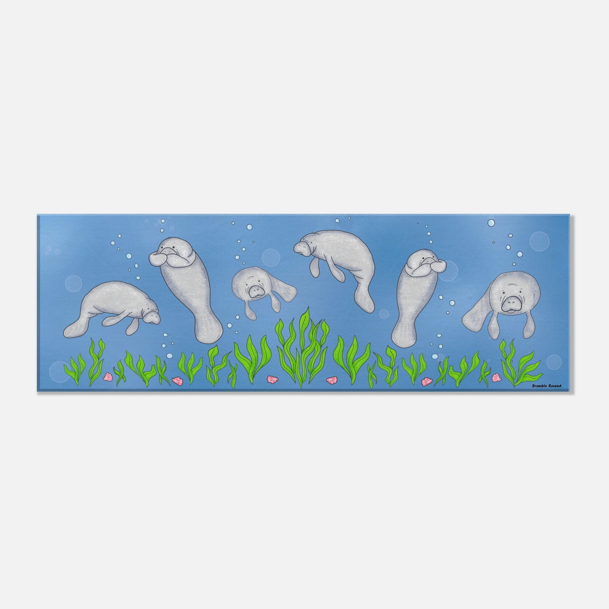 16 by 32 inch slim canvas wall art print featuring cute illustrated manatees swimming above the seabed. Hanging hardware included.