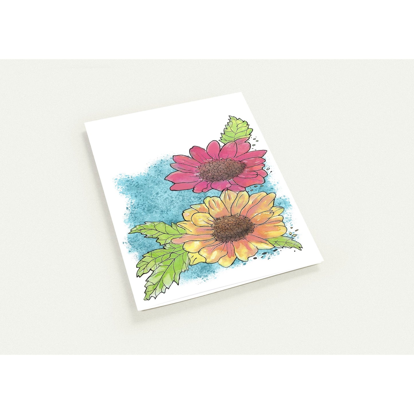 5 by 7 inch Gerber daisies set of 10 greeting cards and 10 envelopes. Printed on glossy paperboard. Front has a print of watercolor Gerber daisies on a blue accent. Inside has a blue watercolor border with daisy accents.