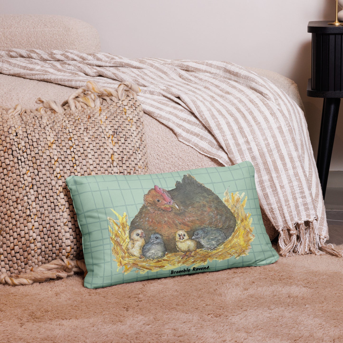 20 by 12 inch mother hen decorative throw pillow. Features Heather Silver's watercolor print of a mother hen and chicks on a green cross-hatched background. Image printed on both sides. Has a hidden zipper and washable cover. Comes with shape-retaining insert.