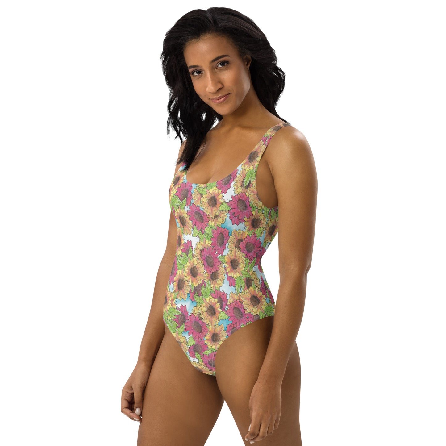 Gerber daisies one piece women's swimsuit. Yellow and red watercolor gerber daisies print. Shown on female model. Available in XS to 3XL.