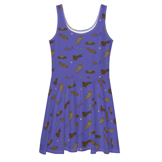 Sleeveless skater dress that features sea otters on a purple background. The soft fabric is made of polyester and spandex, so it is both smooth and stretchy. It has a mid-thigh length flared skirt and elastic waistline.