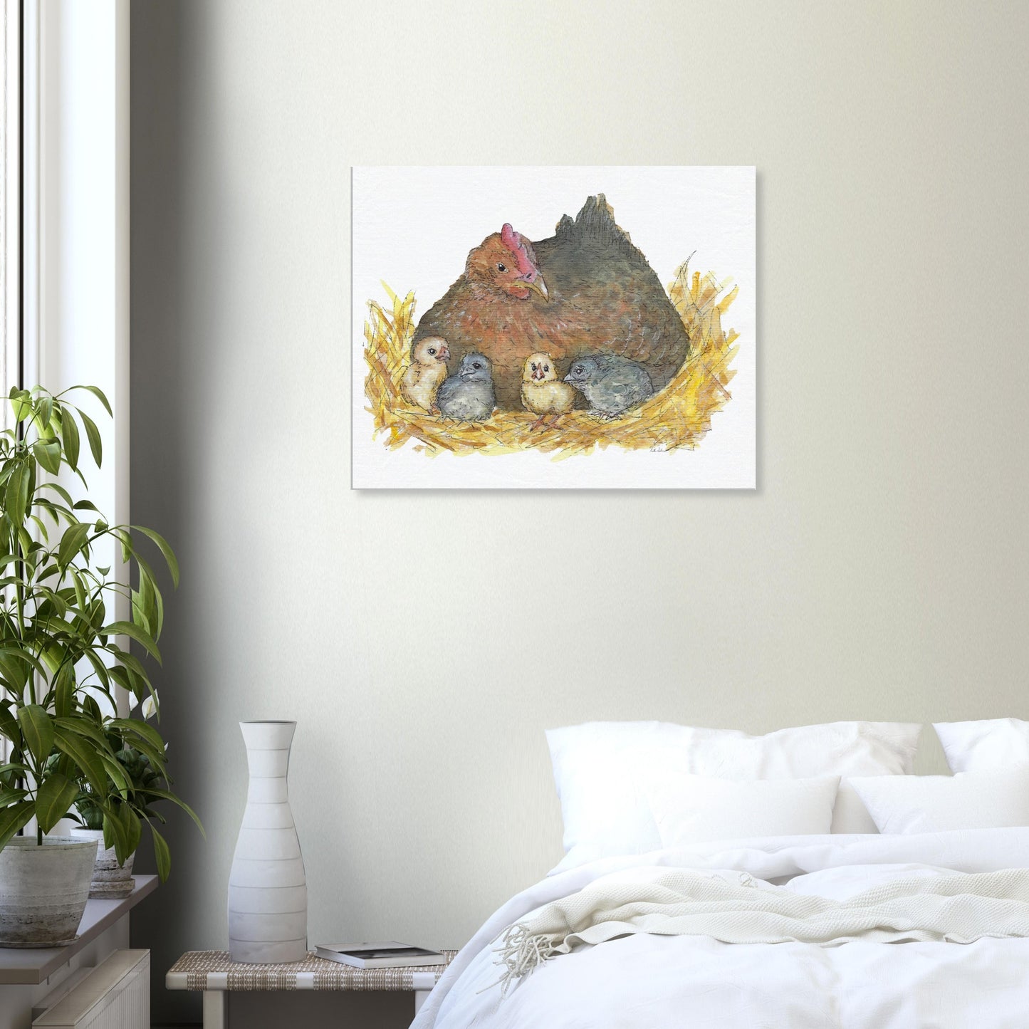 24 by 30 inch slim canvas Mother Hen print. Features a watercolor mother hen and her four chicks in a nest. Shown on tan wall above white bed.