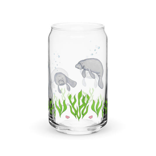 Can-shaped glass holds 16 fluid ounces. Has a design of manatees swimming above the seaweed with bubble and shell accents.