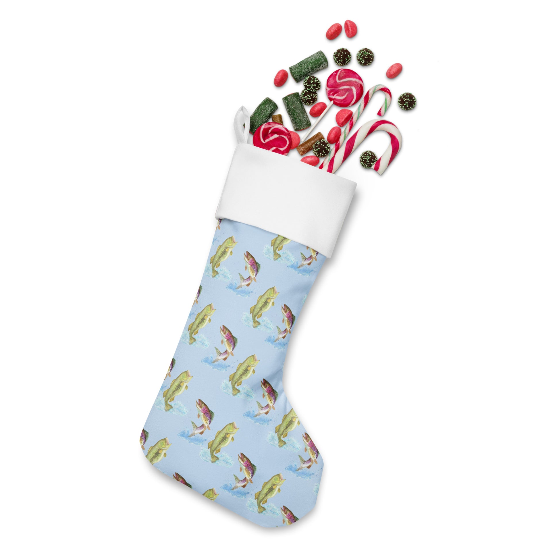 Limited Edition Blue Fishing Christmas Stocking.  7 by 18 inches. The front has watercolor rainbow trout and largemouth bass patterned on a blue background and an off-white polyester back fabric. It has a white fold-over cuff and a hanging loop. Shown stuffed with candy.