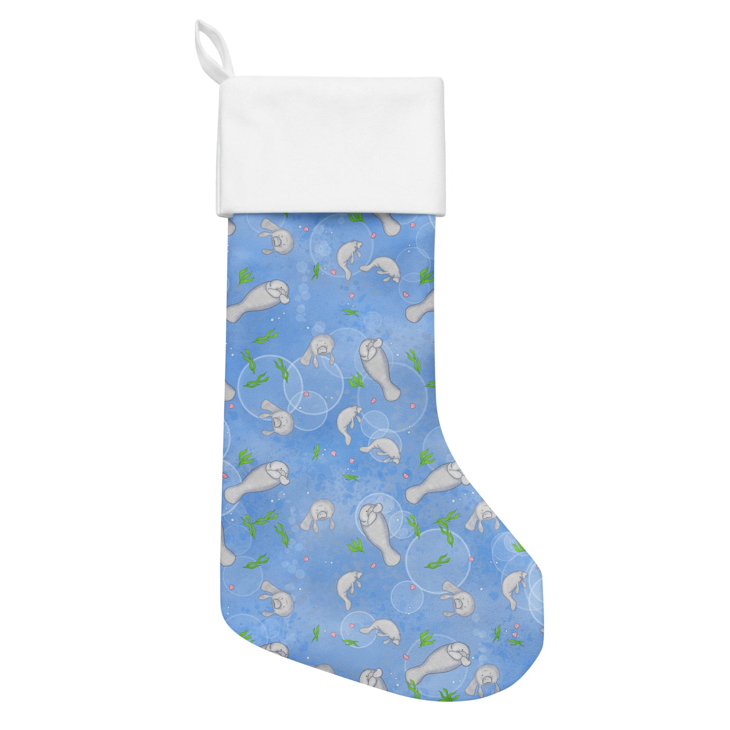 Limited Edition Manatee Christmas Stocking.  7 by 18 inches. The front has a hand-illustrated manatee design with an off-white polyester fabric on the back. It has a white fold-over cuff and a loop for hanging. Flat lay view.