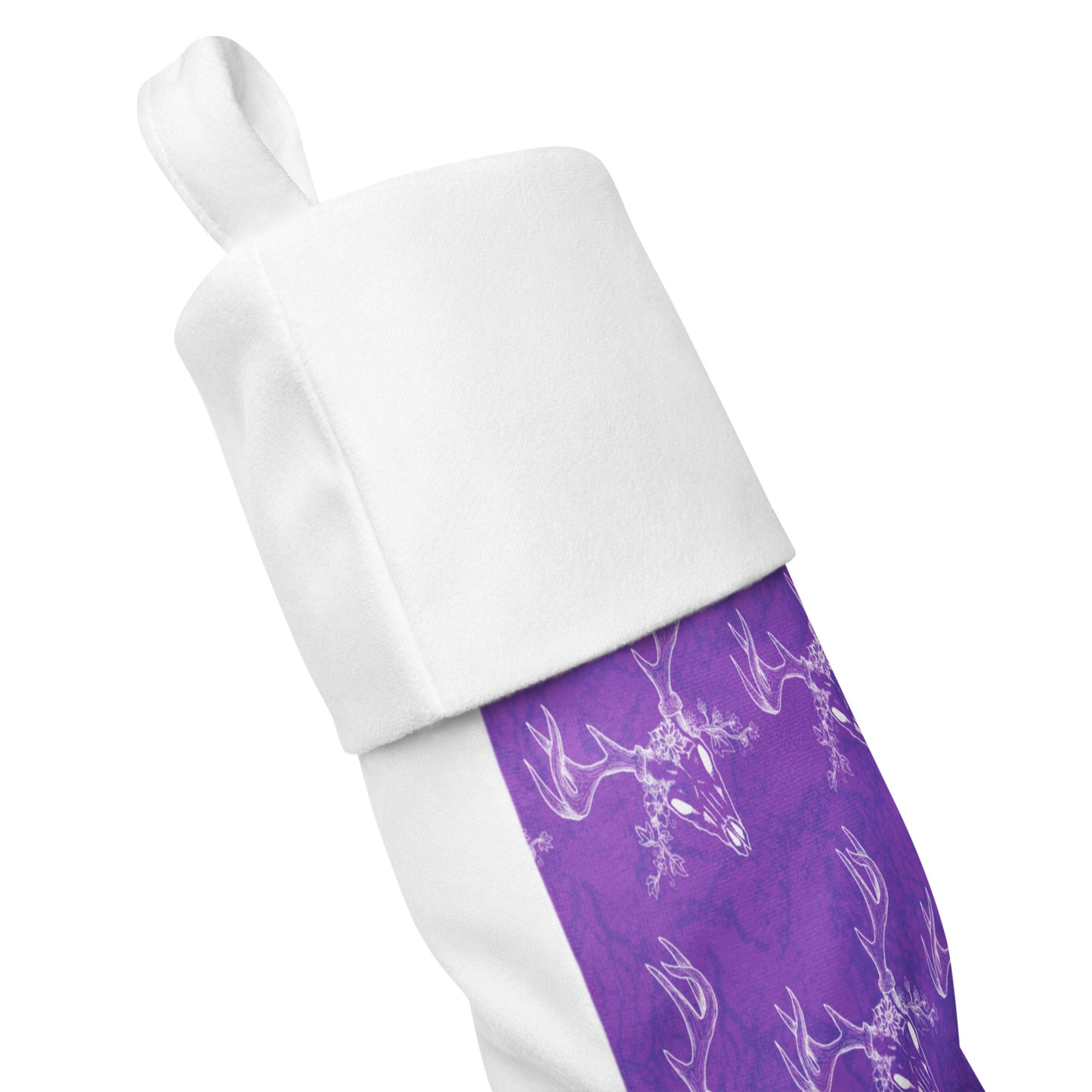 Limited Edition Purple Deer Skull Christmas Stocking.  7 by 18 inches. The front has a hand-illustrated deer skull design on a purple background with an off-white polyester fabric on the back. It has a white fold-over cuff and a loop for hanging. Side view shows front and back fabric.