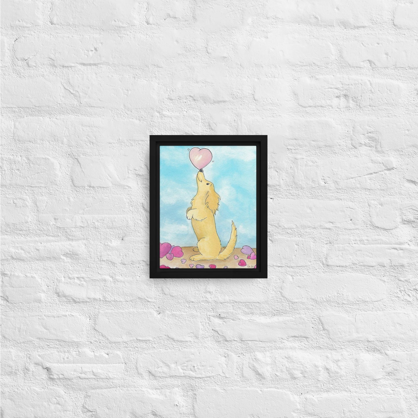 8 by 10 inch framed canvas Puppy Love print. The canvas is in a black pine wood frame. Shown on white brick wall.