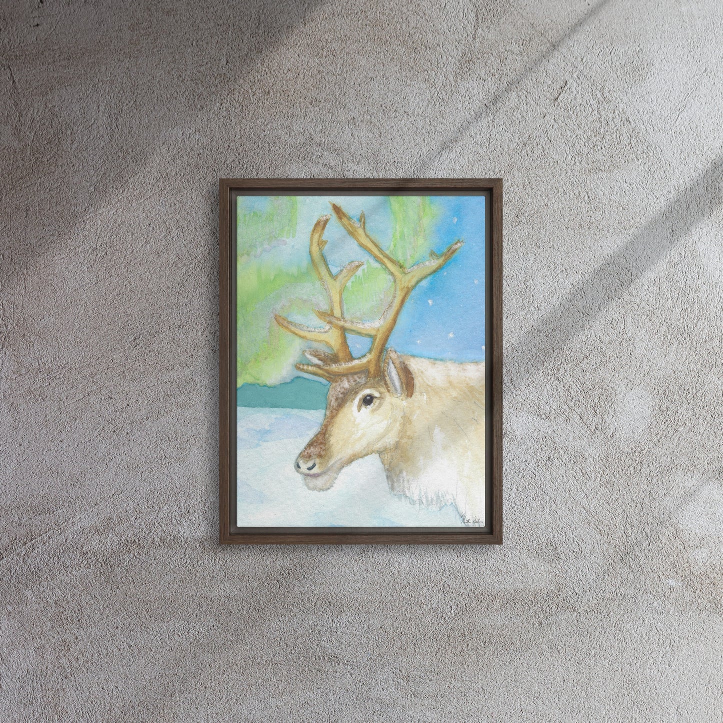 12 by 16 inch framed canvas art print of Heather Silver's Northern Lights Reindeer.  Canvas print mounted in a brown pine frame. Hanging hardware included. Shown on carpet with natural lighting.