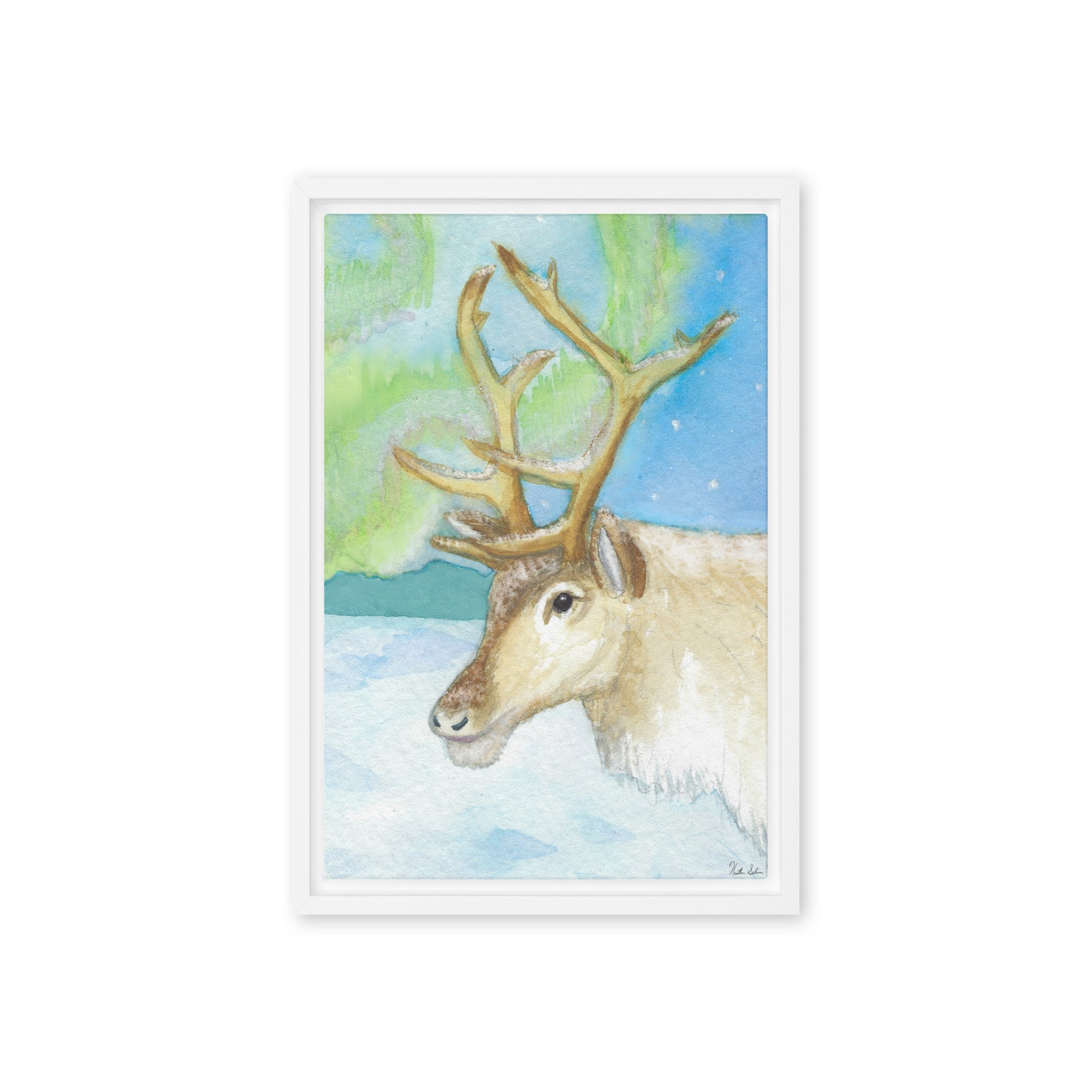 12 by 18 inch framed canvas art print of Heather Silver's Northern Lights Reindeer.  Canvas print mounted in a white pine frame. Hanging hardware included.