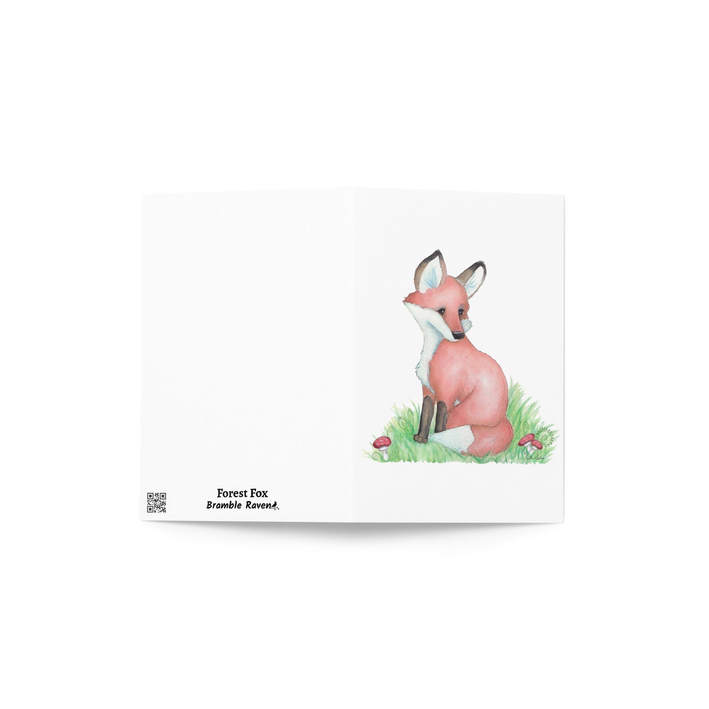 4 by 6 inch forest fox greeting card. Front has watercolor print of a fox in the grass by mushrooms and ferns. Inside is blank. Comes with a white envelope. Made of durable paperboard with vibrant printing. Shows front and back cover.