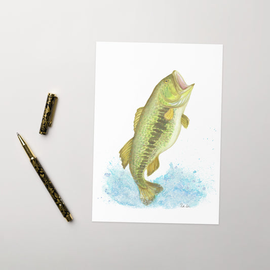 Ten greeting cards with envelopes. The front features a watercolor largemouth bass leaping from the water. Inside is blank. Made with thick 350 gsm 150lb coated paperboard with vibrant printing.   The cards measure 5.5 by 8.5 inches. Shown on tabletop by ballpoint pen.