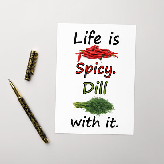 Ten humorous greeting cards with ten envelopes. The front features the saying: "Life is spicy. Dill with it," with chili peppers and dill weed graphics. Inside is blank. Made with thick 350 gsm 150lb coated paperboard with vibrant printing. The cards measure 5 by 7 inches. Shown on tabletop by ballpoint pen.