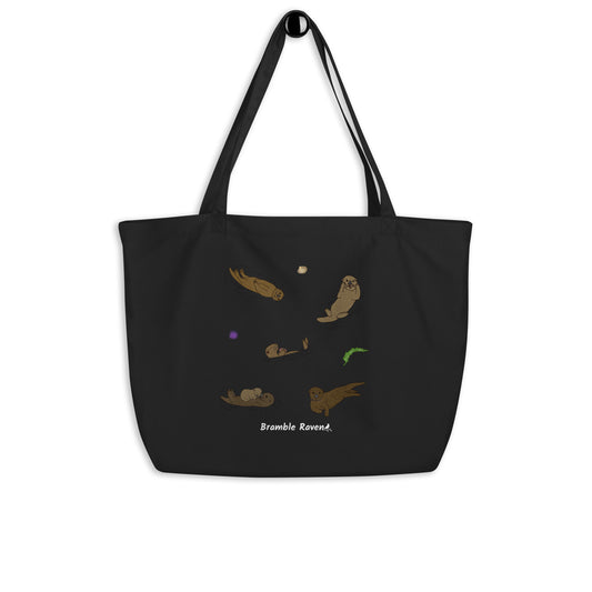 Original illustrated design of cute sea otters. Printed on large black colored eco tote. 20 by 14 by 5 inches. 100% recycled cotton.