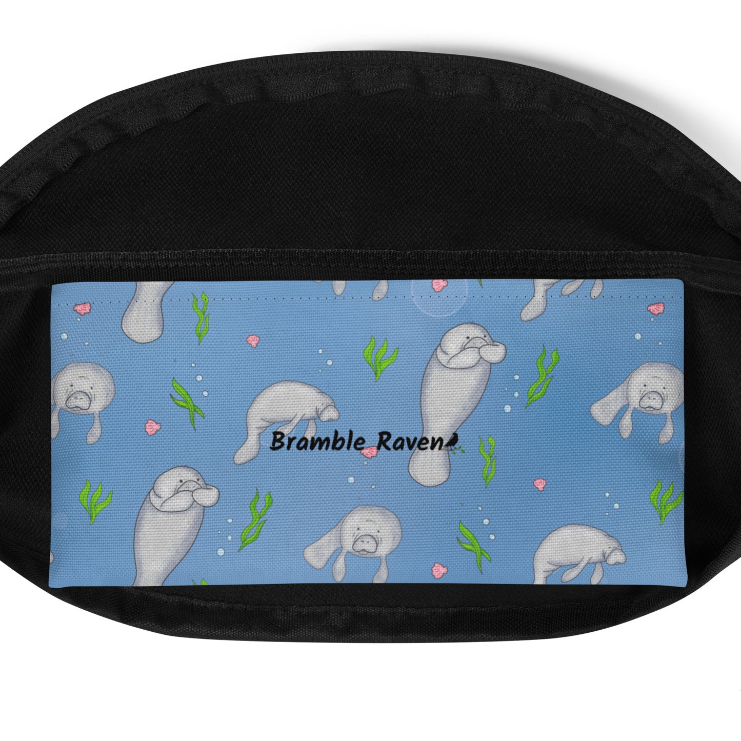 Cute manatee patterned belt bag with adjustable straps, zippered pouch, and small inner pocket. Inside pocket detail view.