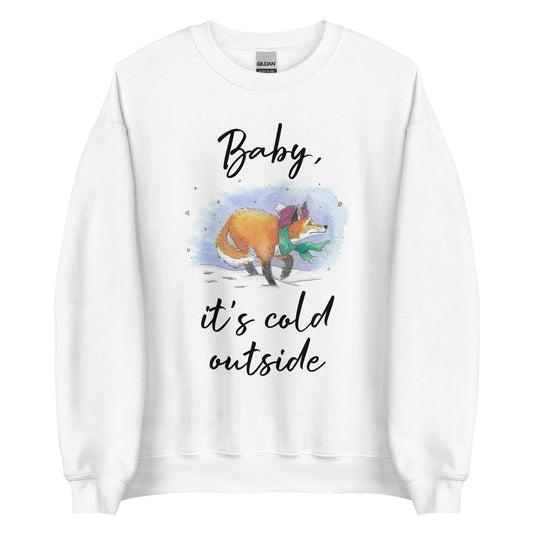 White unisex crew neck sweatshirt. Features black text saying Baby, it's cold outside, and a watercolor fox with a hat and scarf in the snow. 