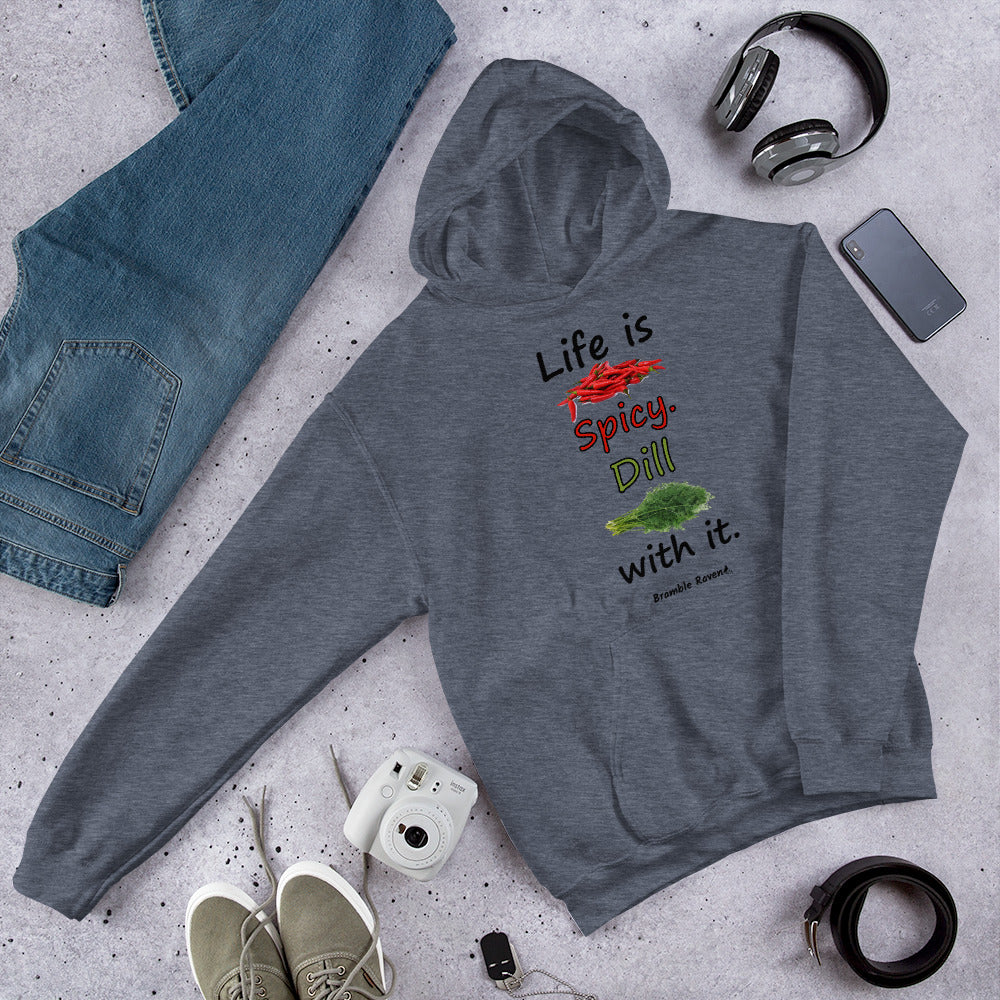 Heather dark grey colored unisex heavy blend hoodie.  Double lined hood, matching drawcord, front pouch pocket. Rib knit cuffs and waistband. Features text and image: Life is spicy. Dill with it.  Shown on floor by jeans, shoes, belt and headphones.
