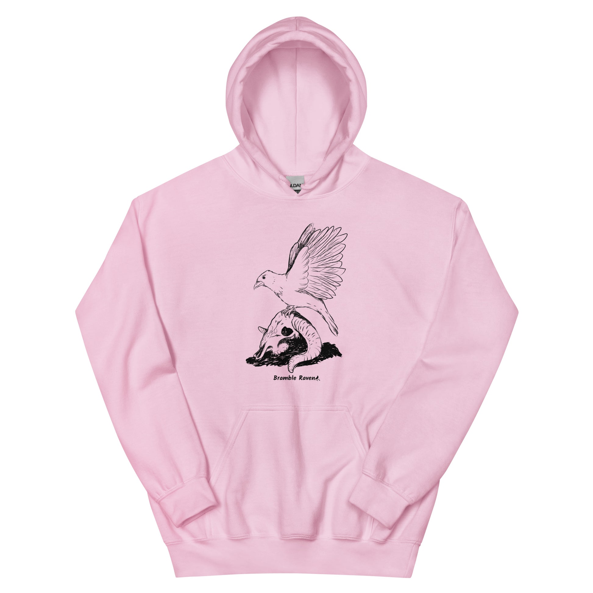 Light pink colored unisex Reflections hoodie. Features image of a crow with wings outstretched sitting on a sheep skull.  Has a front pouch pocket and double lined hood.