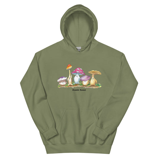 Military green colored unisex cotton/polyester blend hoodie. Features front design of Mushy and his whimsical mushroom friends. Hoodie has double lined hood, front pouch pocket, rib knit cuffs and stretchy waistband.