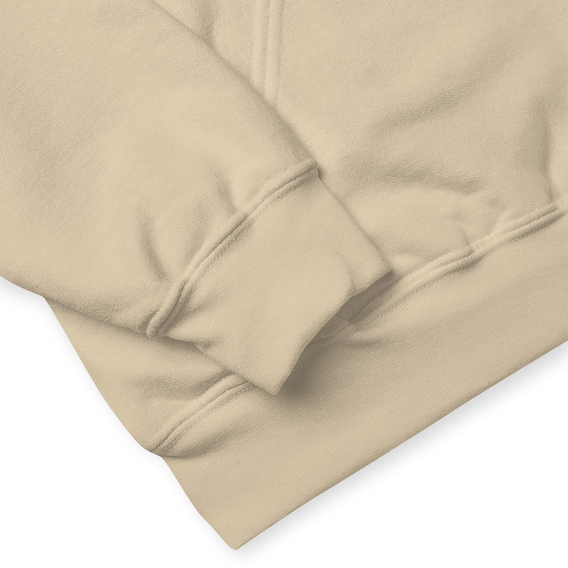 Sand colored unisex cotton/polyester blend hoodie. Features front design of Mushy and his whimsical mushroom friends. Hoodie has double lined hood, front pouch pocket, rib knit cuffs and stretchy waistband. Image shows detail view of cuffs and waistband.