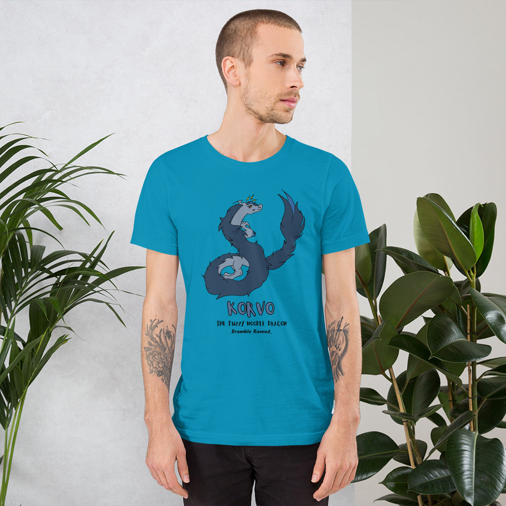 Korvo the angry Fuzzy Noodle Dragon on an aqua blue unisex t-shirt. Shown on a male model by some plants.