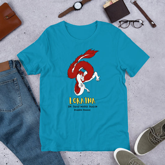 Loraina the Fuzzy Noodle Dragon on an aqua blue unisex t-shirt. Shown surrounded by pants, shoes, glasses, a watch, and wallet.
