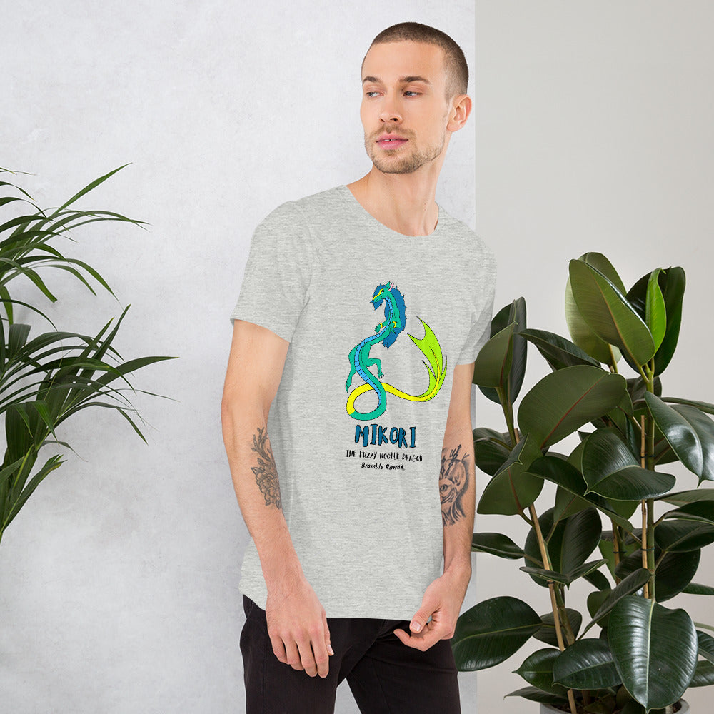 Mikori the Fuzzy Noodle Dragon on an athletic heather grey unisex t-shirt. Shown on a male model by some plants.