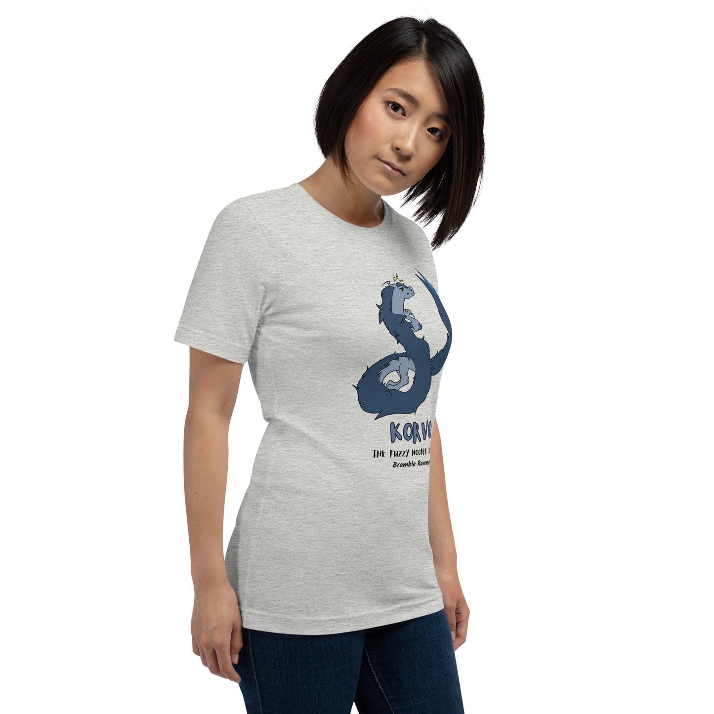 Korvo the angry Fuzzy Noodle Dragon on an athletic heather grey unisex t-shirt. Shown on a female model.