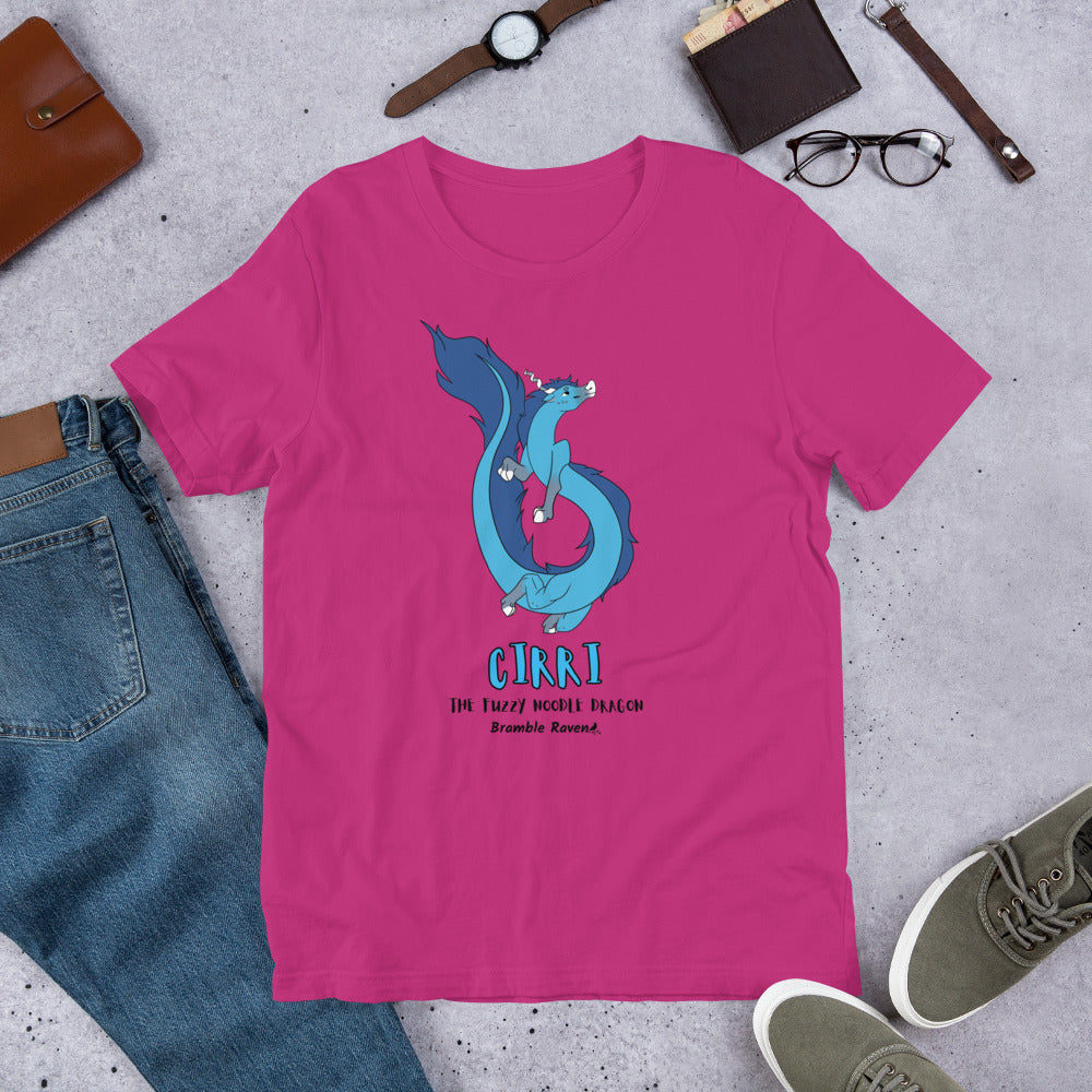 Cirri the Fuzzy Noodle Dragon on a berry pink unisex t-shirt. Shown surrounded by pants, shoes, glasses, a watch, and wallet.