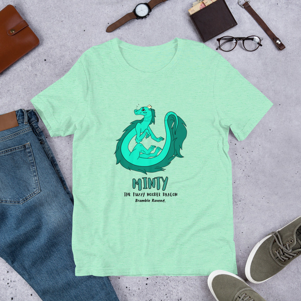 Minty the Fuzzy Noodle Dragon on a heather mint unisex t-shirt. Shown surrounded by pants, shoes, glasses, a watch, and wallet.