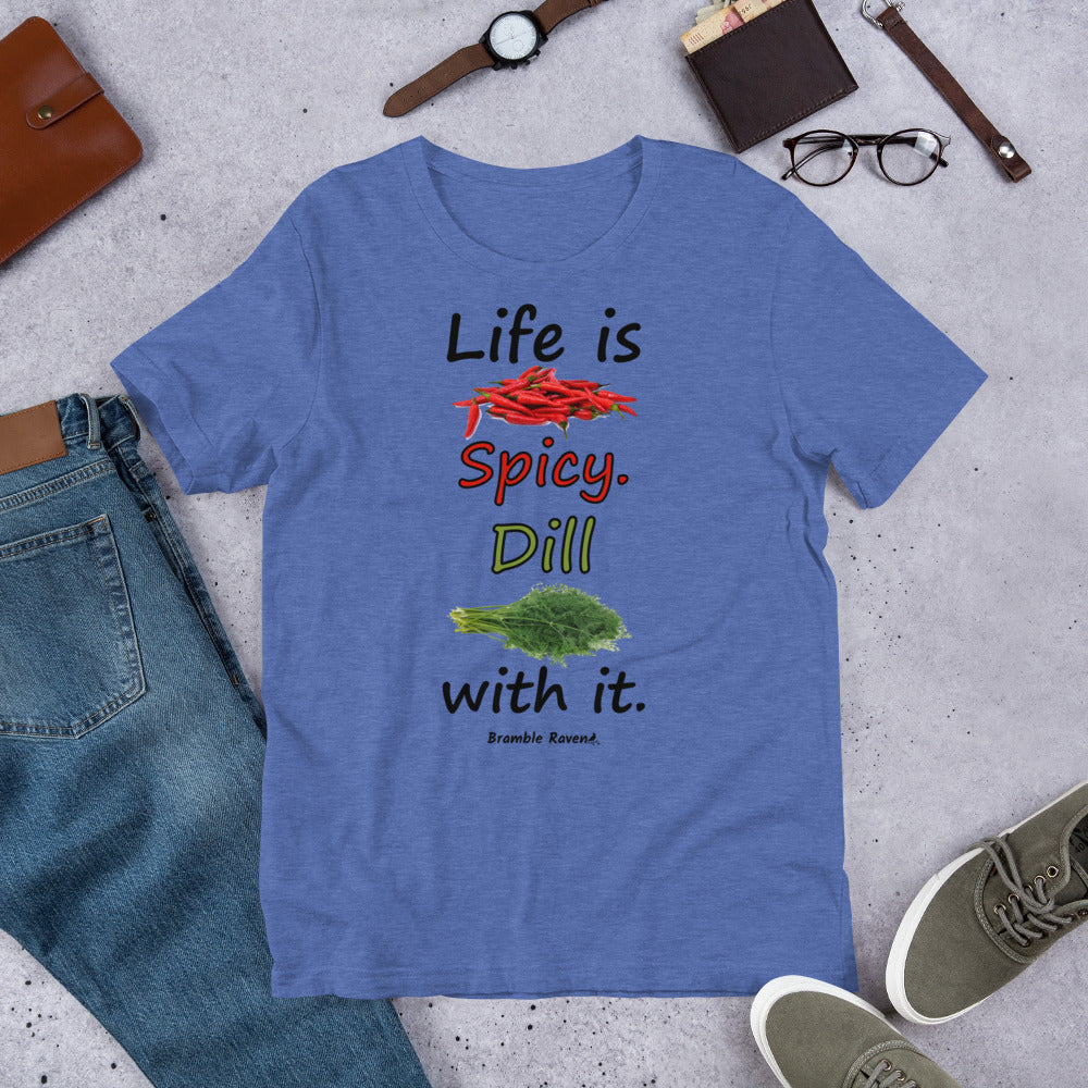Heather true royal blue colored unisex t-shirt. Features text: Life is Spicy. Dill with it. Graphic of chili peppers and dill weed. Made of preshrunk cotton with side seams. Shown on floor by pants, shoes, wallet and glasses.