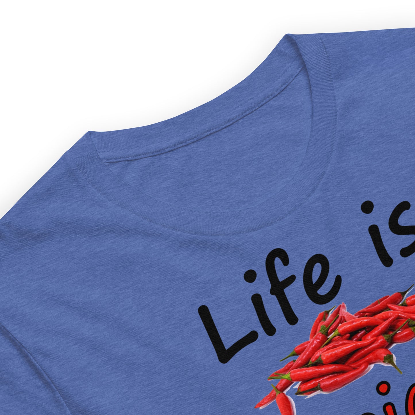 Heather true royal blue colored unisex t-shirt. Features text: Life is Spicy. Dill with it. Graphic of chili peppers and dill weed. Made of preshrunk cotton with side seams. Detail view of neckline.