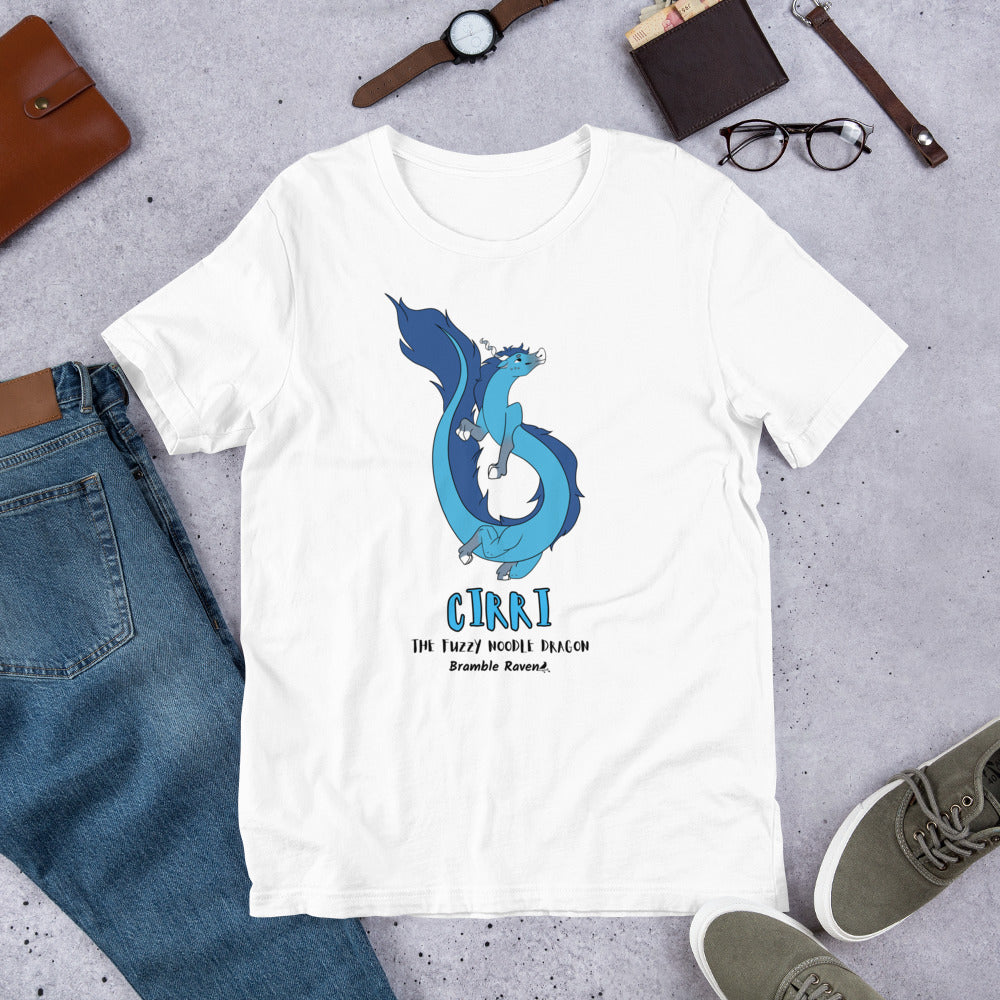 Cirri the Fuzzy Noodle Dragon on a white unisex t-shirt. Shown surrounded by pants, shoes, glasses, a watch, and wallet.