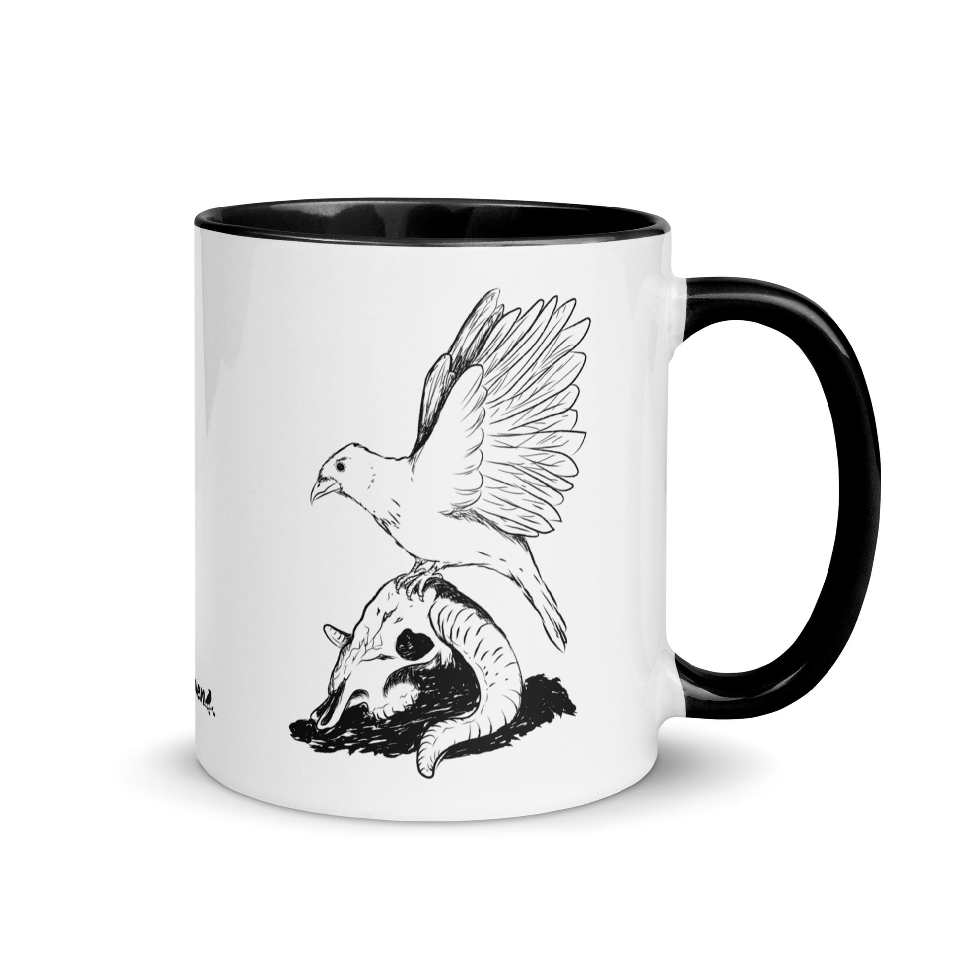 11 ounce white ceramic mug with black handle and inside. Features a double sided print of Reflections, a design with a crow sitting on a sheep skull. Dishwasher and microwave safe.