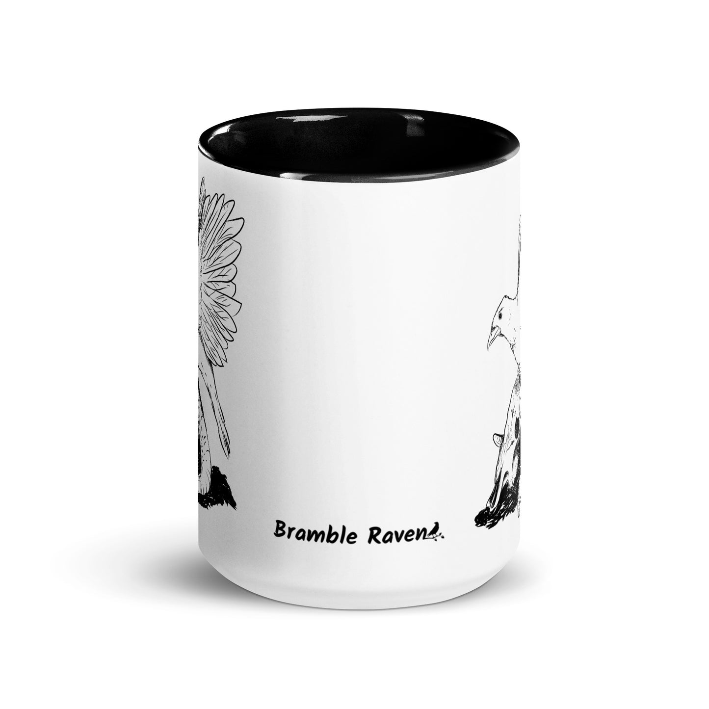 15 ounce white ceramic mug with black handle and inside. Features a double sided print of Reflections, a design with a crow sitting on a sheep skull. Dishwasher and microwave safe. Front view.