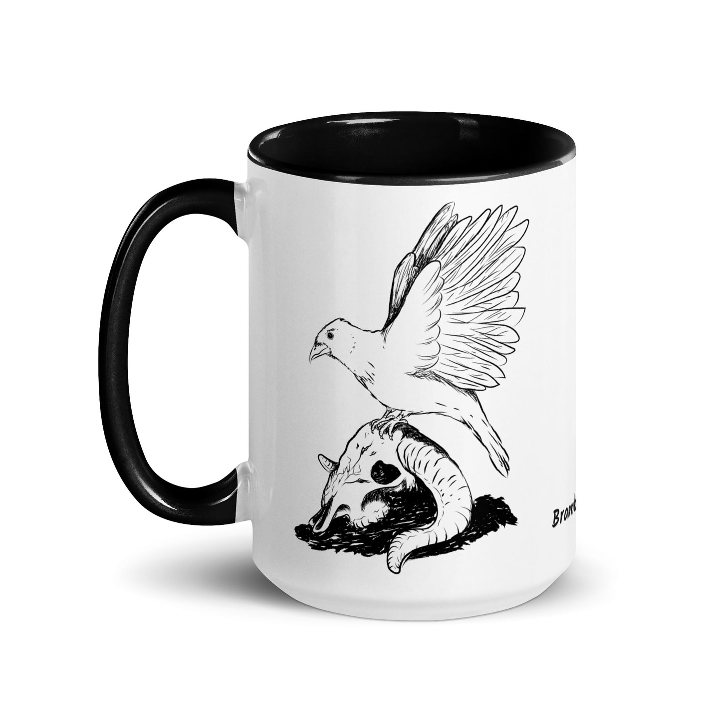 15 ounce white ceramic mug with black handle and inside. Features a double sided print of Reflections, a design with a crow sitting on a sheep skull. Dishwasher and microwave safe.