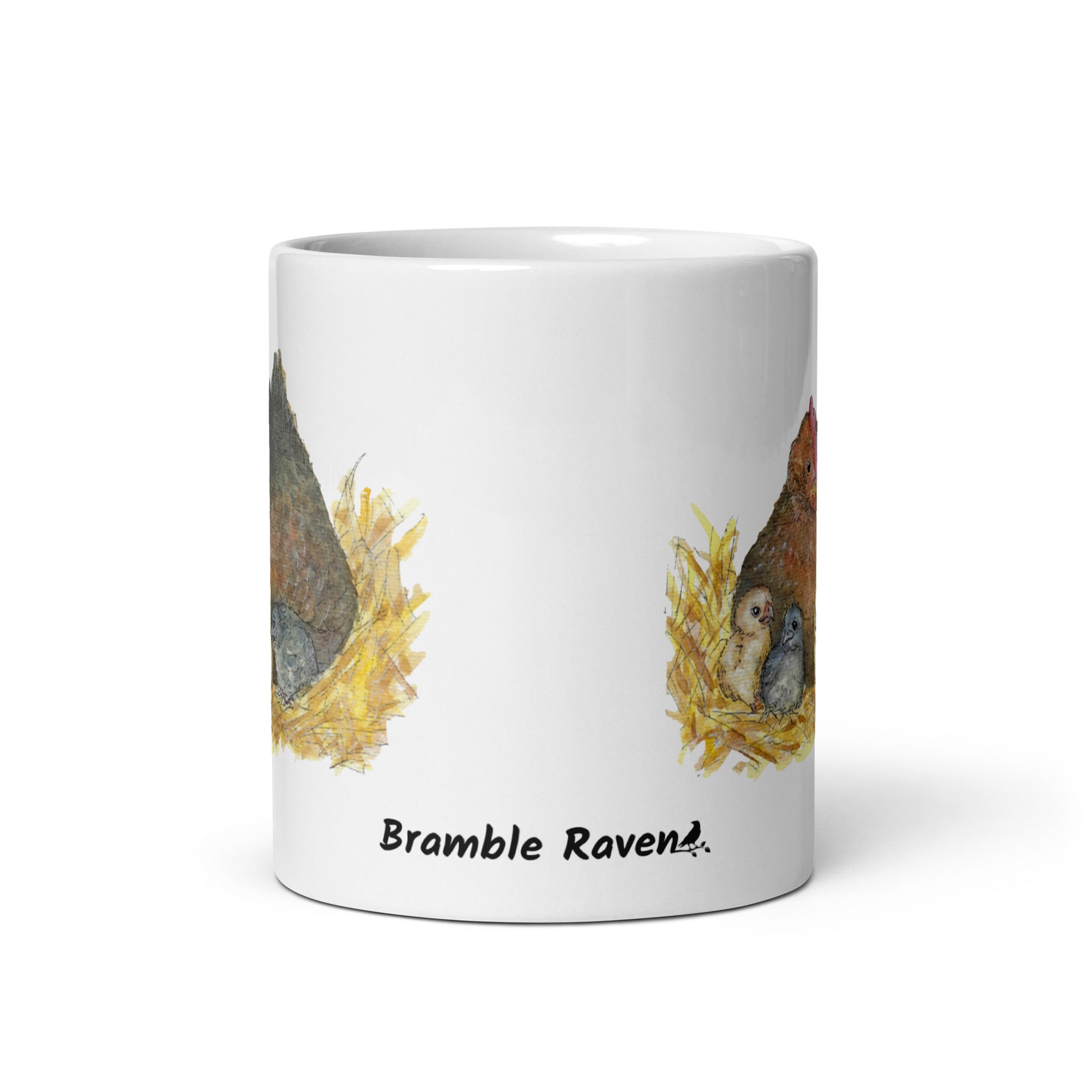 11 ounce white ceramic mug. Features double-sided print of a watercolor mother hen and chicks. Dishwasher and microwave safe. Front view of mug with Bramble Raven logo.