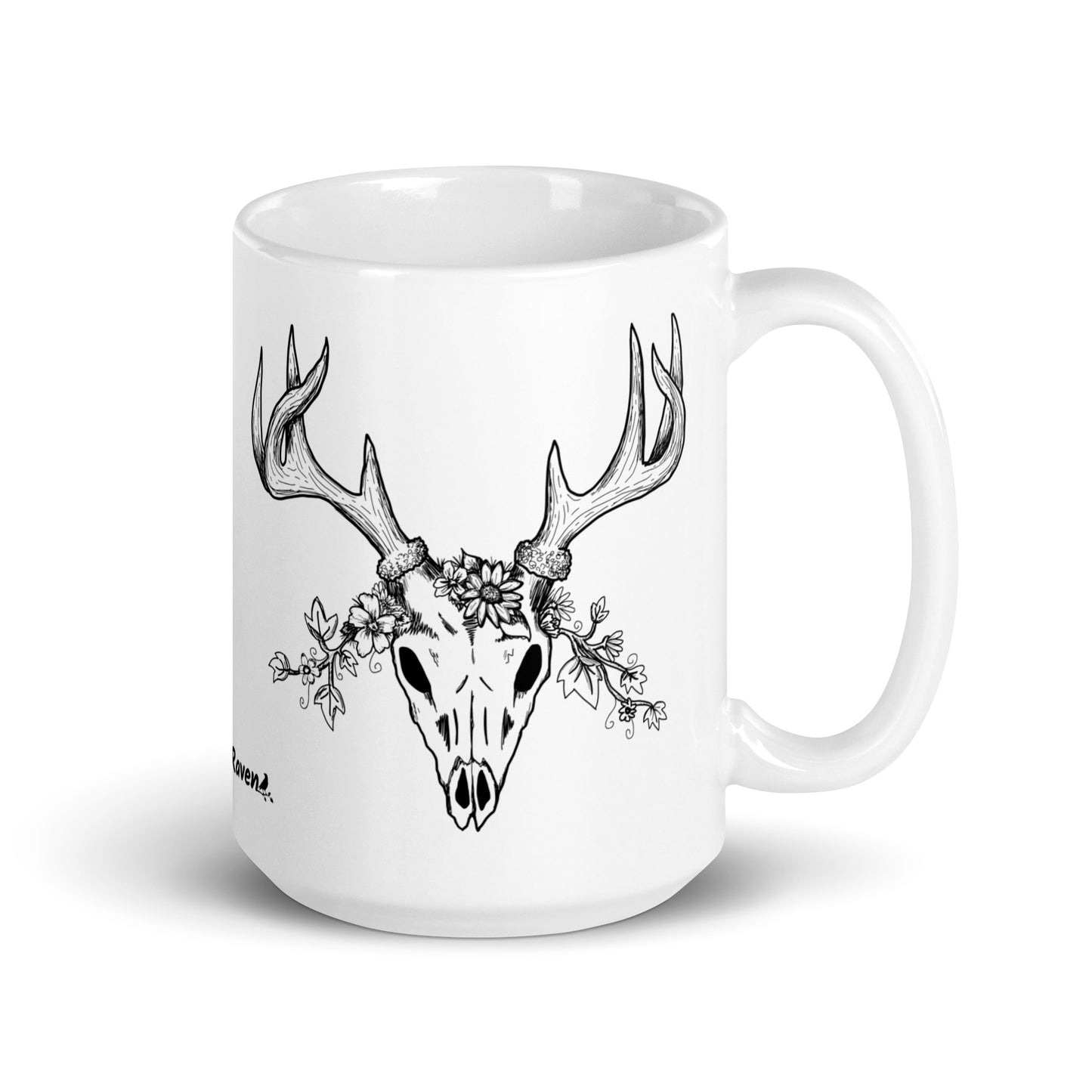 15 oz white ceramic mug. Features a double-sided hand illustrated image of a deer skull wreathed in flowers.