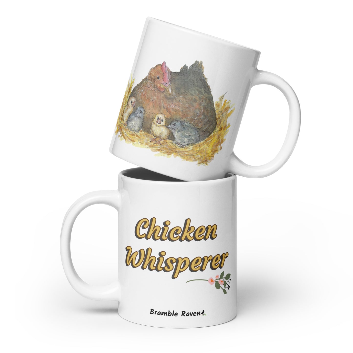 20 ounce white ceramic chicken whisperer mug. Features print of watercolor mother hen and chicks on one side and chicken whisperer text on the other. Dishwasher and microwave safe.
