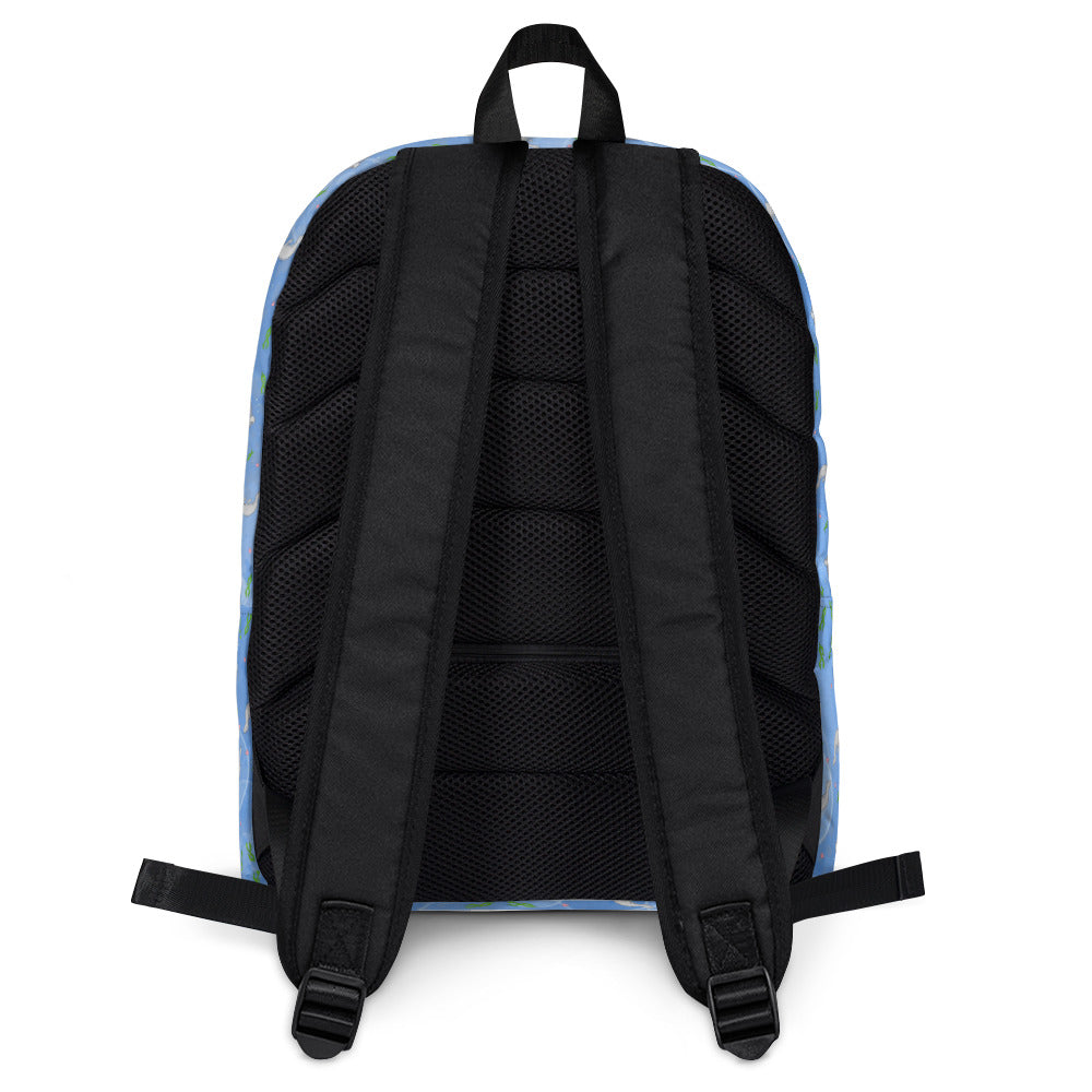 Medium-sized backpack featuring manatees, seashells, seaweed and bubbles on a blue background. Made with water resistant polyester, ergonomic straps, and comfort mesh back. Has a compartment that can hold a 15 inch laptop. Has a hidden zipper pocket on the back. Image shows comfort mesh back and straps.