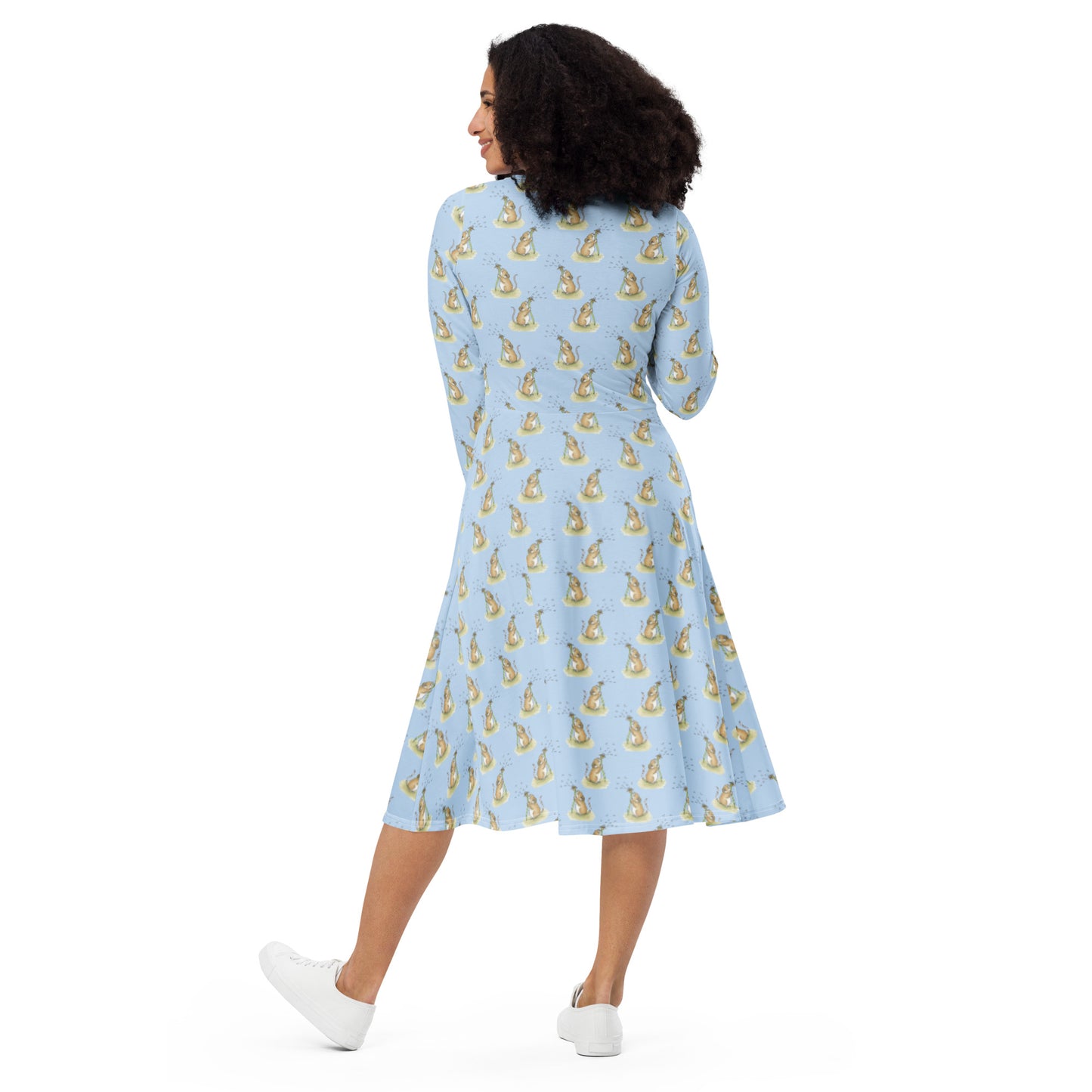 Dandelion Wish patterned long sleeve midi dress. Features patterned design of a mouse making a wish on a dandelion fluff against a light blue background. Dress has boat neckline, fitted waist, flared bottom, and side pockets. Shows back view on female model.
