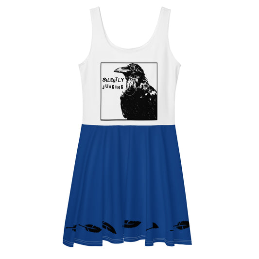 This sleeveless skater dress features our Silently Judging crow design on a white top with feather details on a mid-thigh length flared blue skirt. Has an elastic waistline. Made from a polyester/spandex blend that is soft and stretchy.