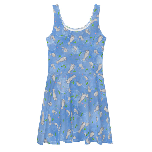 Sleeveless skater dress that features manatees on on ocean blue background. The soft fabric is made of 82% polyester and 18% spandex, so it is both smooth and stretchy. It has a mid-thigh length flared skirt and elastic waistline.