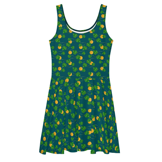 Sleeveless skater dress with three leaf clovers and lucky gold coins on a dark green background. Mid-thigh length skirt and fitted waist.