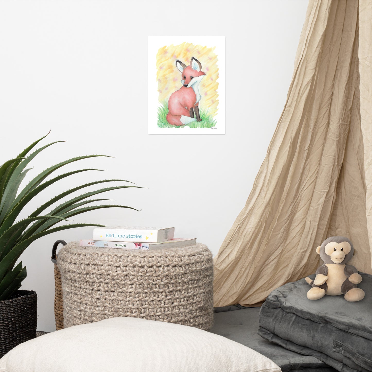 11x14 matte paper art print. Giclée quality printing. Design is a watercolor painting of a fox in the grass against a yellow background. Shown on the wall by tan curtain and monkey plush.